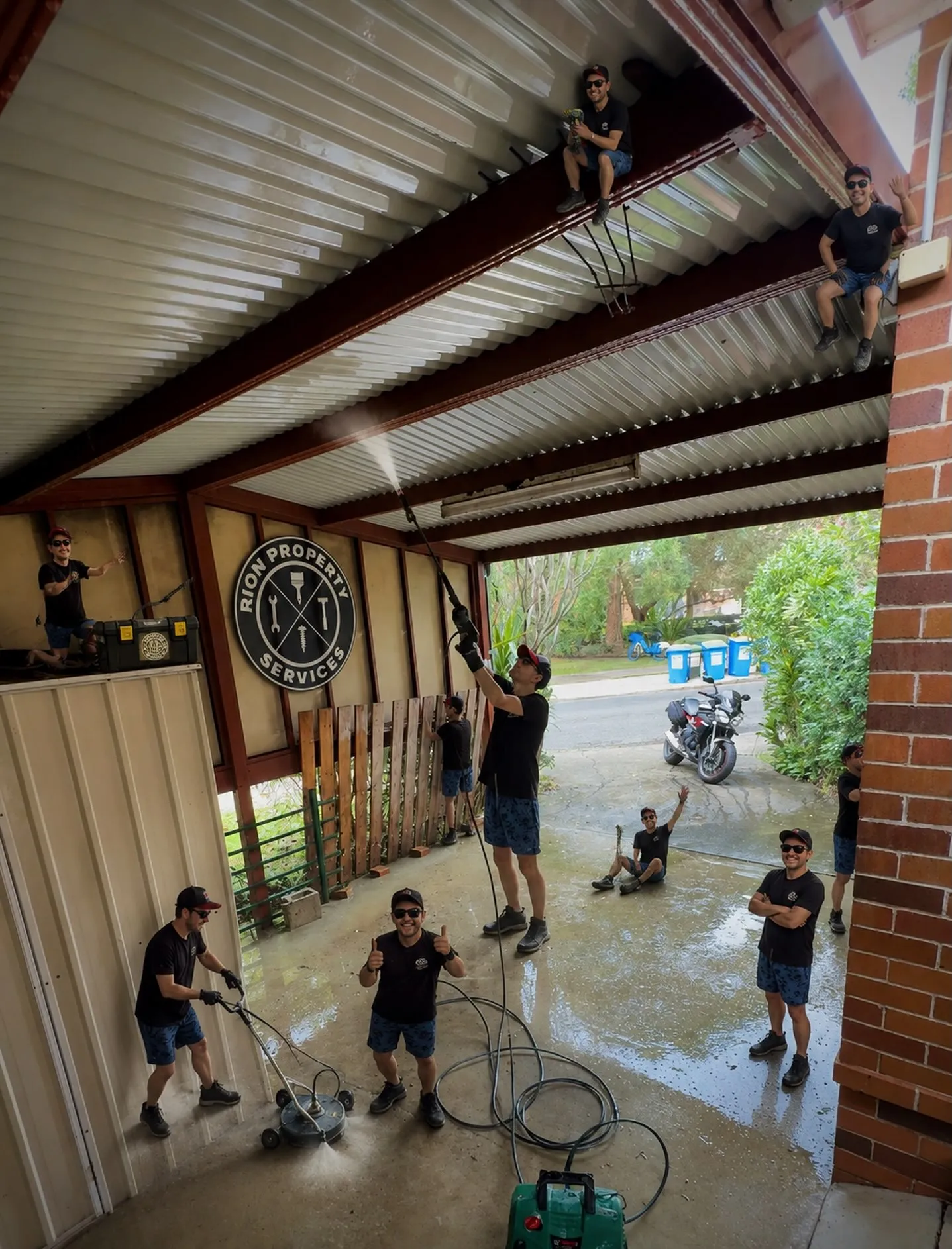 Rion pressure washing a covered patio and driveway